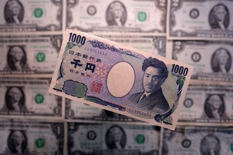 Illustration shows Yen and U.S. dollar banknotes
